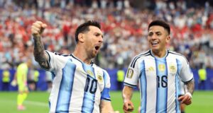 Argentina reach knockouts as Messi scores historic double